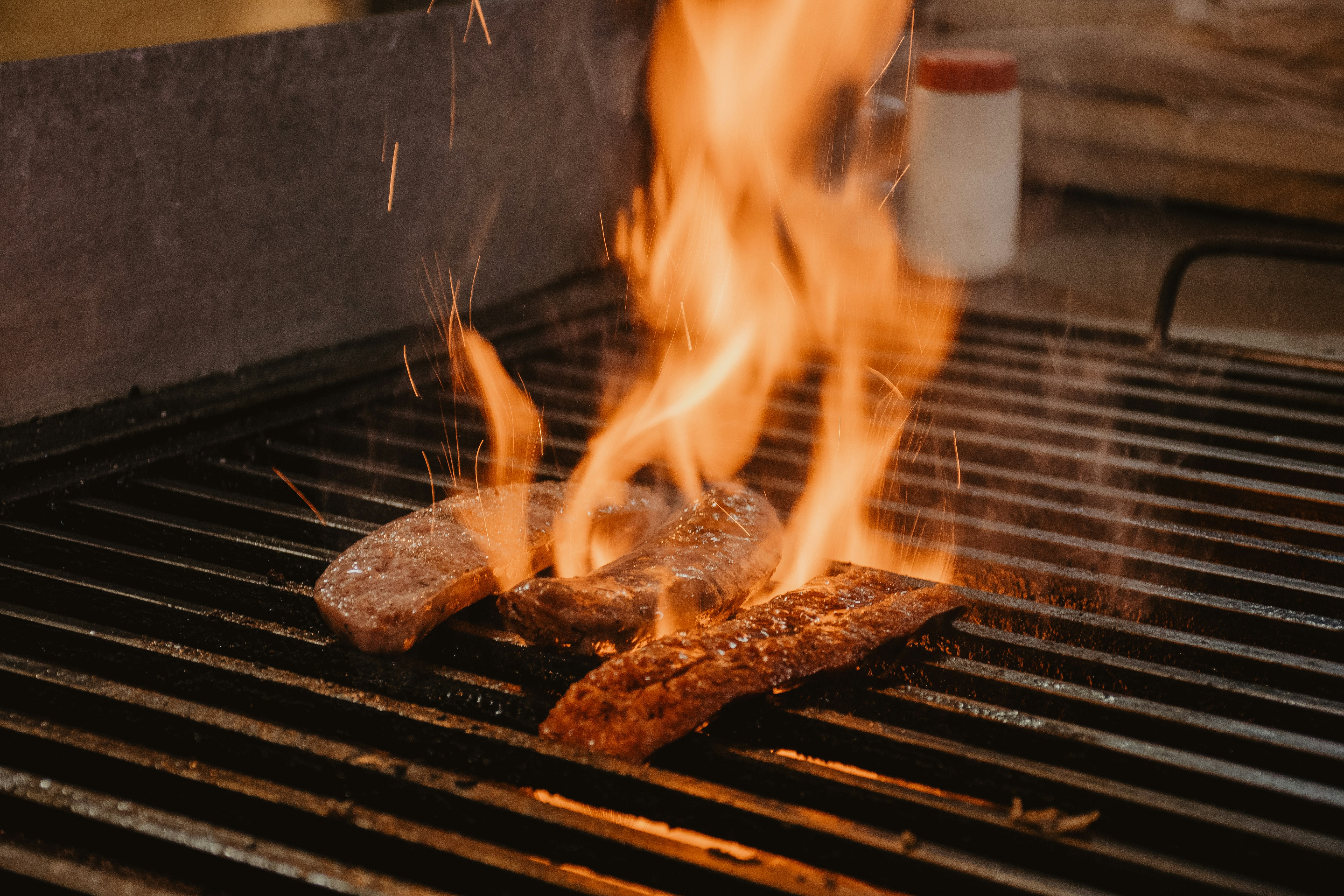 grilled meat on charcoal grill